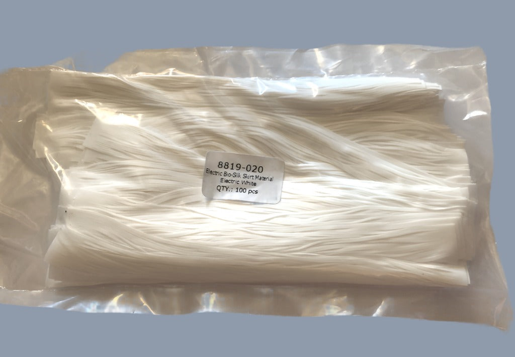 Close-up of Champions Choice Electric Bio-Silk skirt tabs in Electric White for fishing lures, showcasing vibrant texture and high-quality material detail