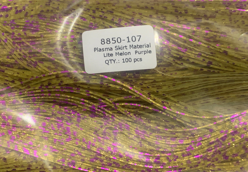 Close-up of a spool of 'Plasma Skirt Material' with purple glitter, labeled 8850-107, on a clear background.